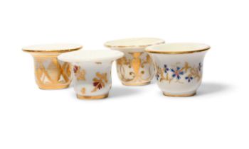 Four Paris porcelain rouge pots, c.1800-20, variously decorated with floral, foliate and geometric