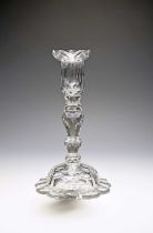 A cut glass candlestick with removable drip pan, late 18th/early 19th century, with a faceted