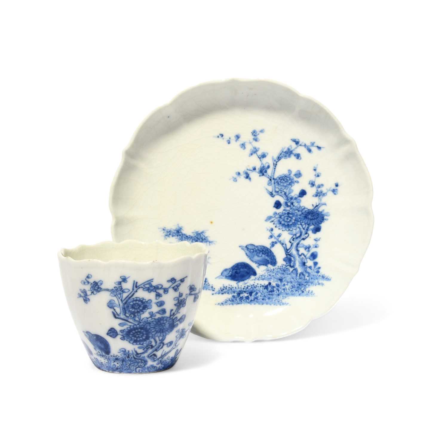 A Chinese soft-paste porcelain blue and white teabowl and saucer, mid 18th century, of lobed form,