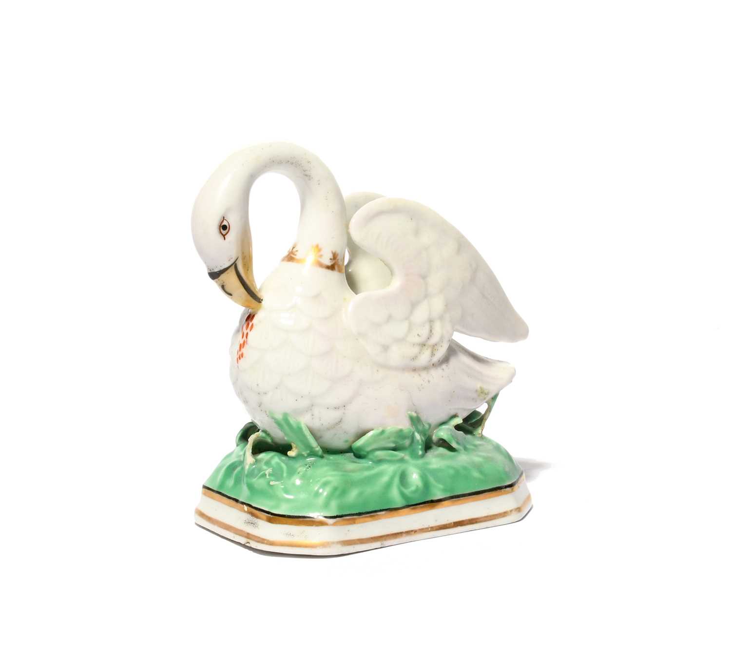 A rare Chamberlain's Worcester figure of the Pelican in her Piety, c.1810-20, the bird modelled with