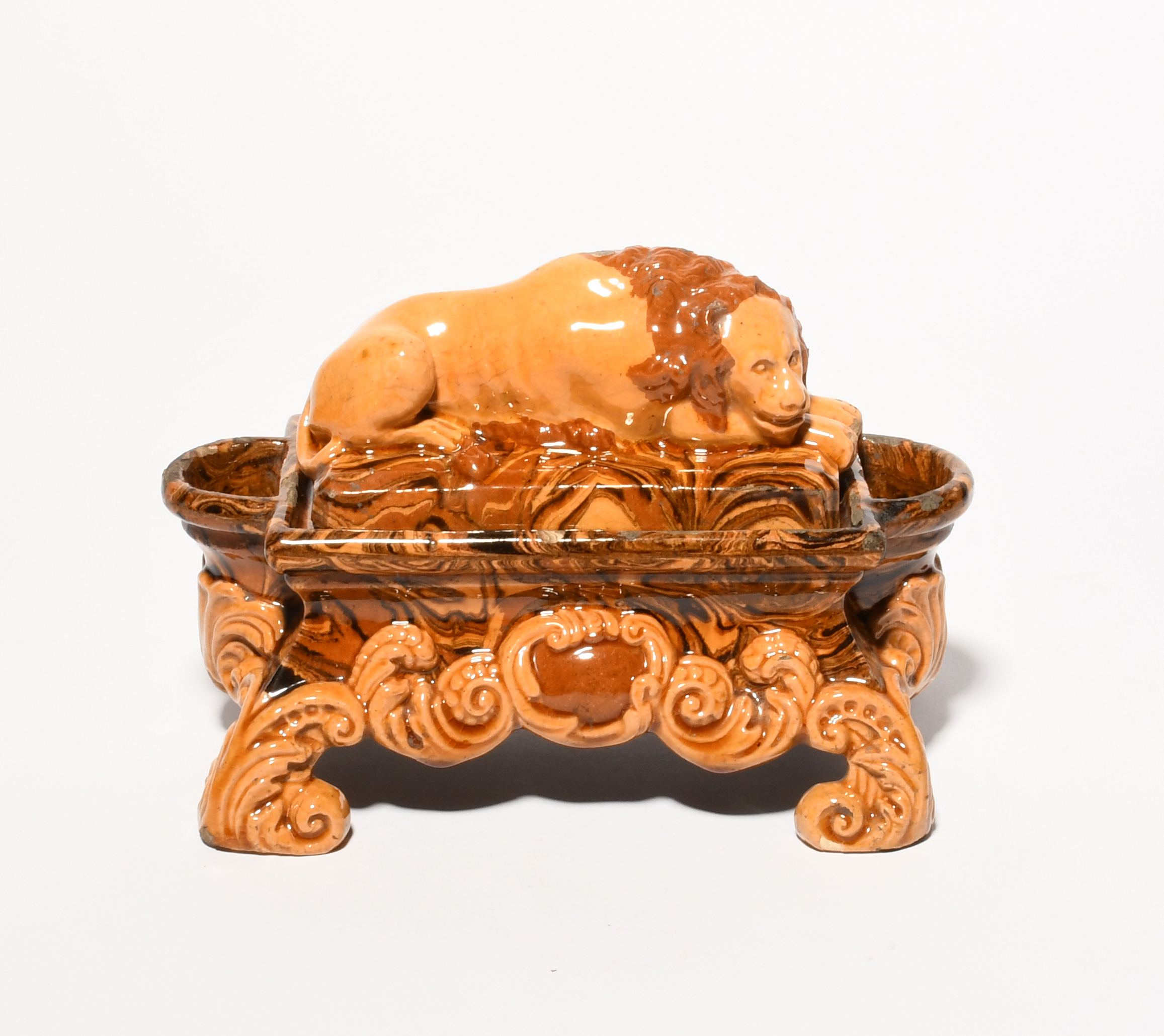 A slipware double inkwell, 19th century, the cover modelled with a recumbent lion, the rectangular - Image 4 of 4
