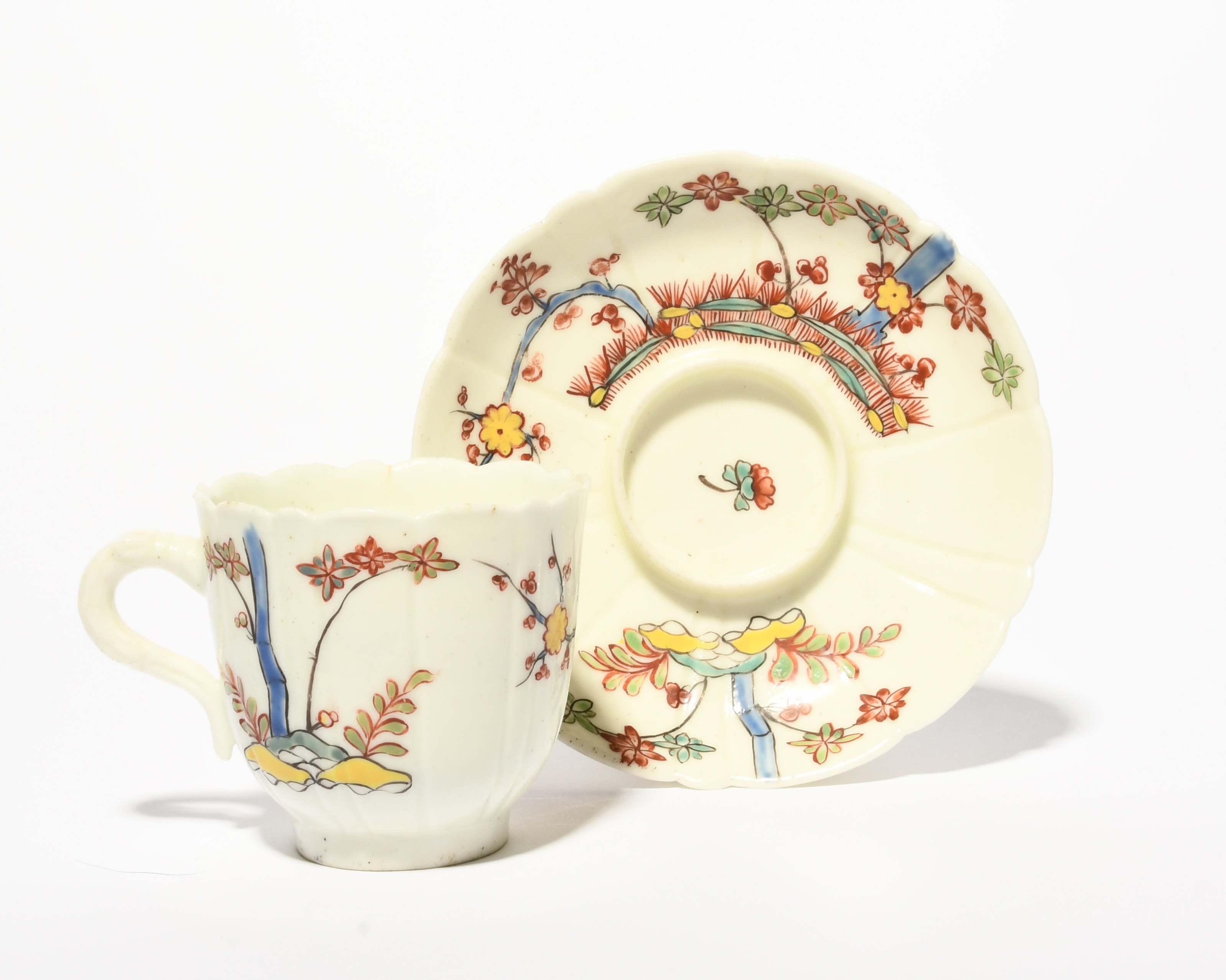 A St Cloud coffee cup and trembleuse saucer, c.1730, the lobed form painted in the Kakiemon manner - Image 2 of 4