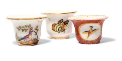 Three Paris porcelain rouge pots, c.1800-20, one painted with colourful birds on short branches,
