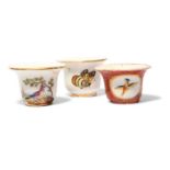 Three Paris porcelain rouge pots, c.1800-20, one painted with colourful birds on short branches,