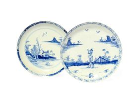 Two Vauxhall blue and white saucers, c.1755-57, one painted with a Chinese figure walking through