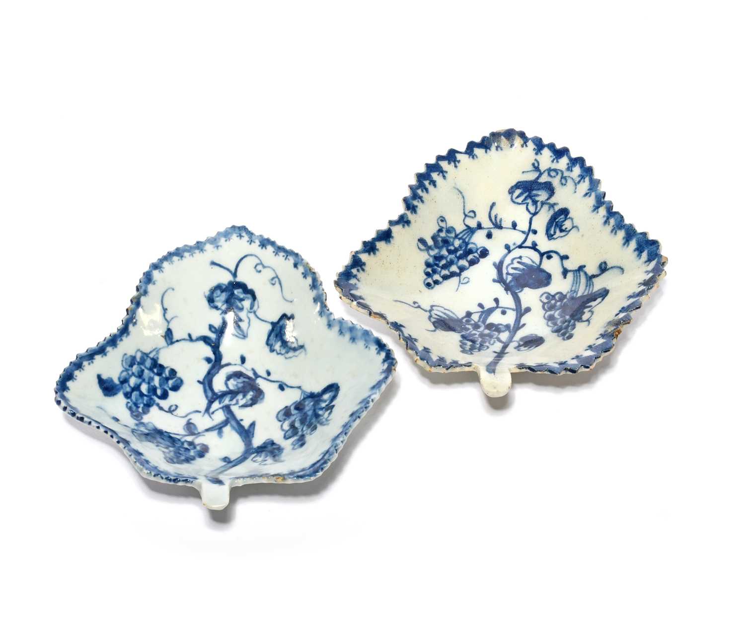 A pair of Lowestoft blue and white pickle dishes, c.1765-70, of leaf form, each painted with a