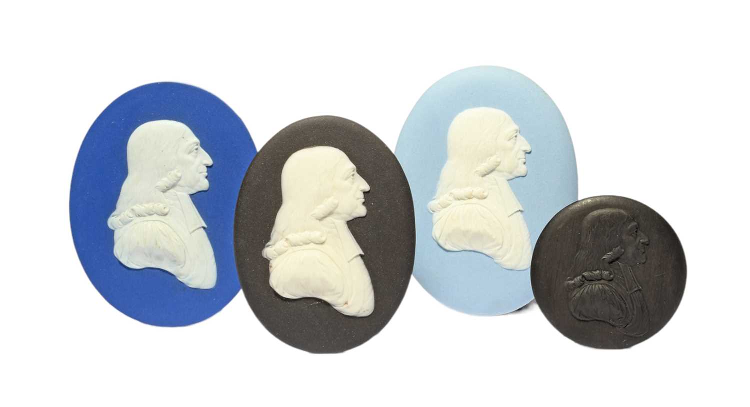 Four Wedgwood portrait plaques, 19th century, three Jasperware and modelled with a profile