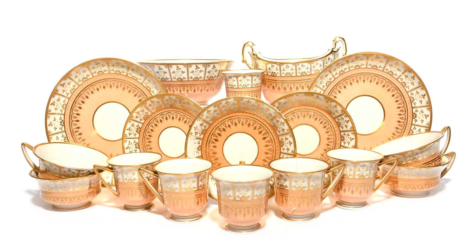 A Flight Barr and Barr part tea service, c.1820, decorated with a gilt panelled border of flower