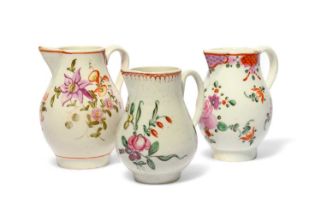 Three English porcelain milk jugs, c.1770-90, two Lowestoft and painted with flowers and trellis