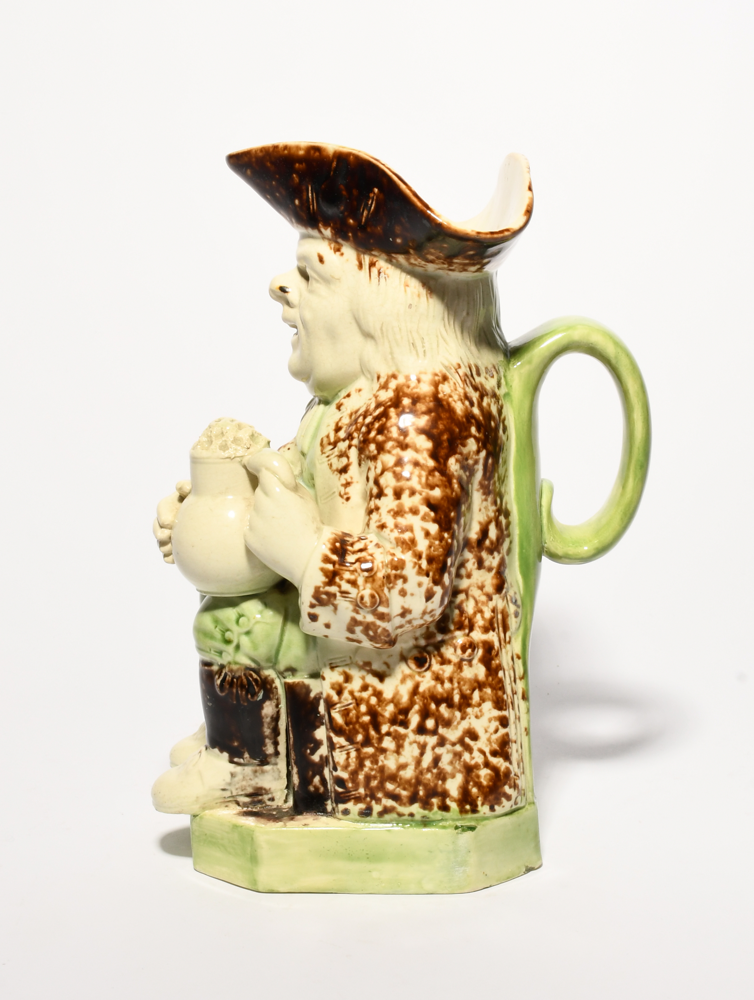 A creamware Wood type Toby jug, c.1790, seated with a foaming jug of ale, his waistcoat and breeches - Image 3 of 3