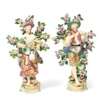 A pair of Chelsea figures of harvesters, c.1765, he carrying a keg on a stick slung over one