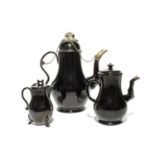 Two Jackfield coffee pots and covers, c.1750, the larger coffee pot with later silver-coloured metal