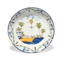 A rare Lambeth delftware shallow dish or bowl, c.1785, painted in blue, green, yellow and