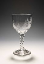 An unusual glass goblet, c.1770, the cup bowl engraved with a scene of a figure carrying ladders