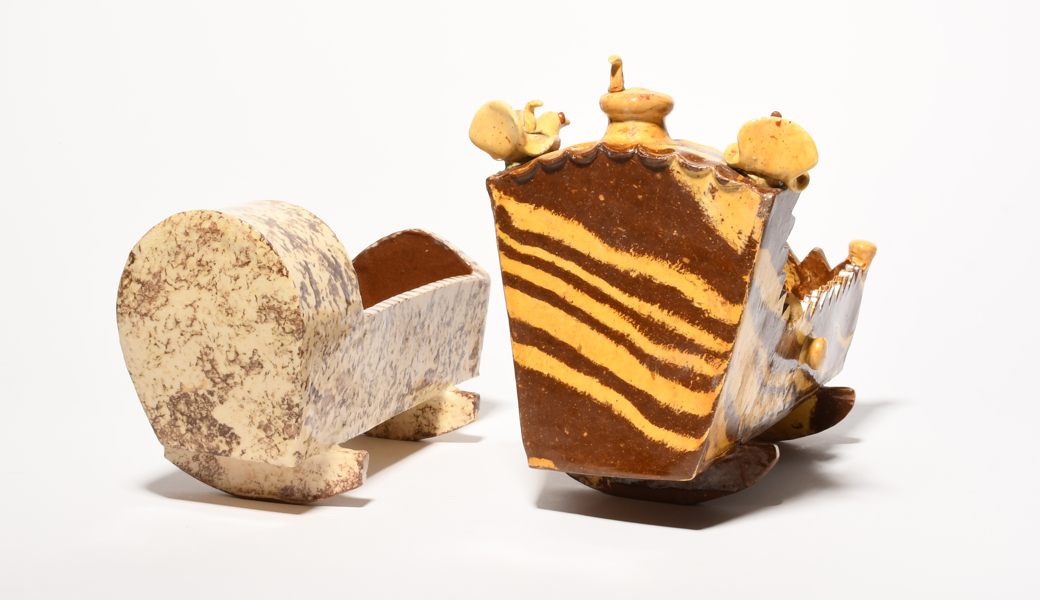 Two slipware models of cradles, 19th century, one with cream and brown striations to simulate agate, - Image 2 of 3