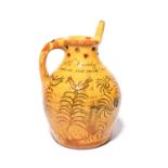 A good Donyatt slipware puzzle jug, dated 1829, with sgraffito decoration of birds perched atop