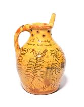 A good Donyatt slipware puzzle jug, dated 1829, with sgraffito decoration of birds perched atop