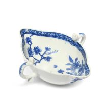 A rare Bow blue and white two-handled sauceboat, c.1750-52, painted in a bright blue with a bird
