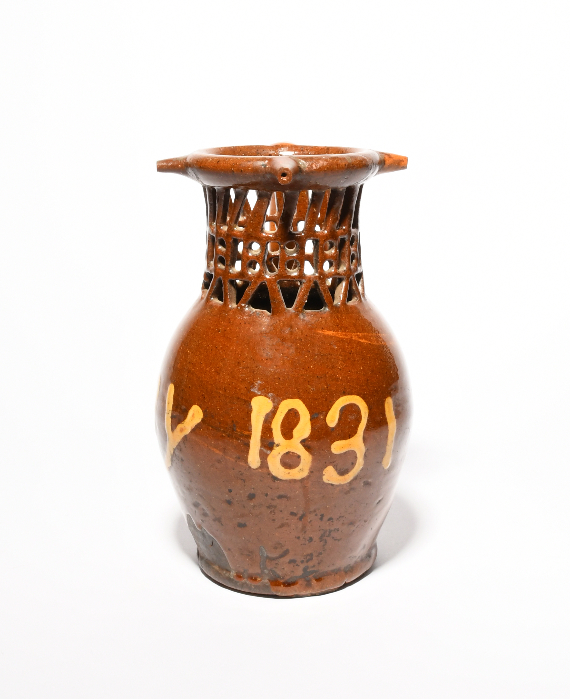 A large slipware puzzle jug, dated 1831, inscribed 'J + ny 1831' in cream slip on a rich treacle - Image 2 of 3