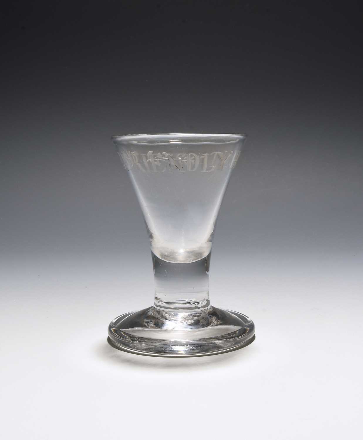 A 'Friendly Hunt' firing glass, c.1750, the drawn trumpet bowl engraved around the rim with 'The
