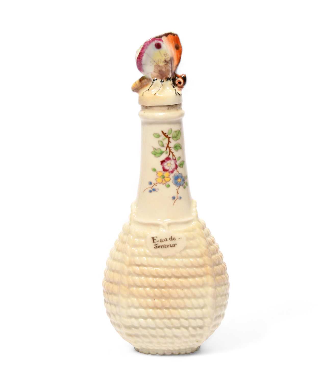 A Chelsea scent bottle, c.1755, modelled as a bottle contained in a pale wicker basket, the neck