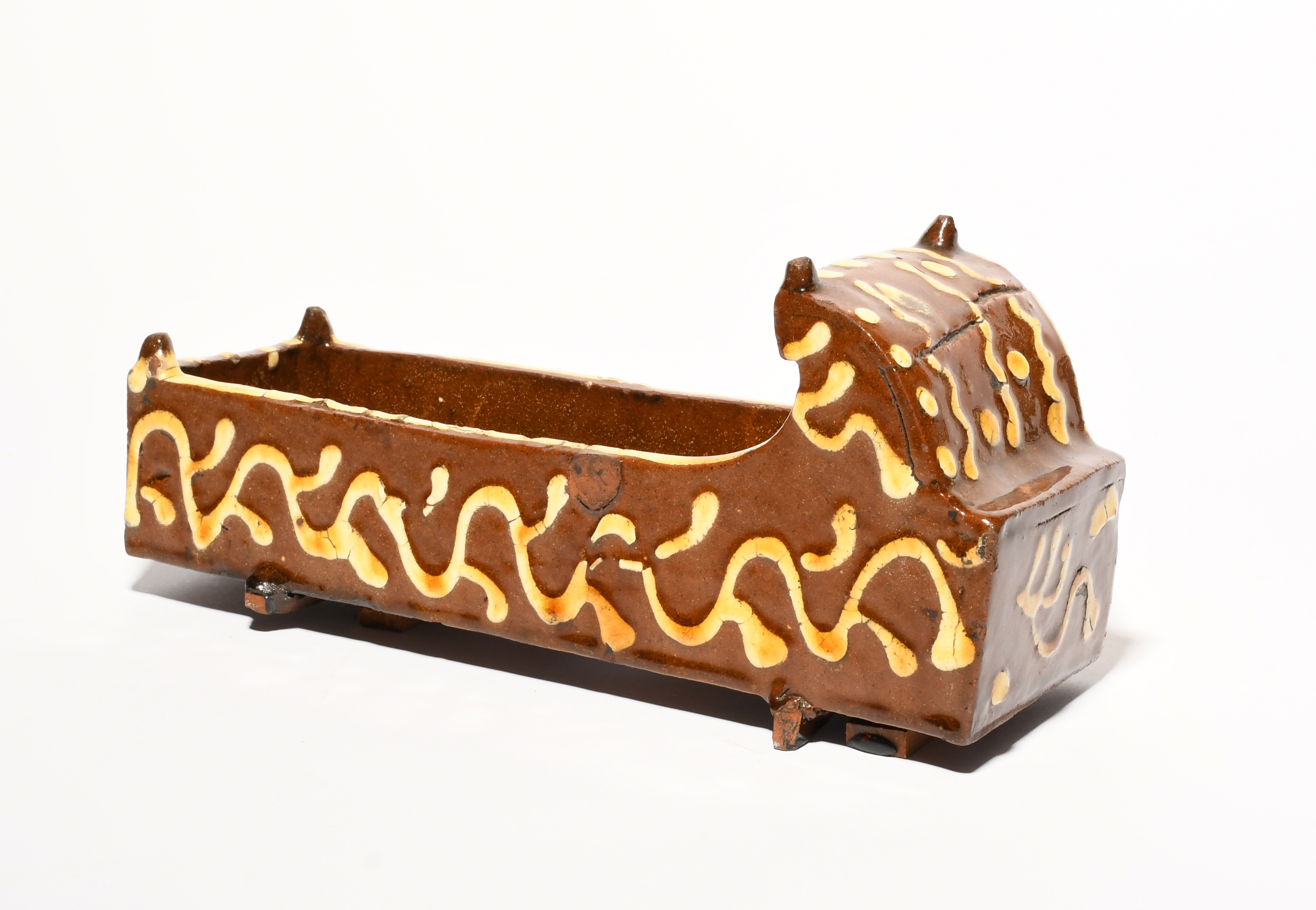 A slipware model of a cradle, dated 1815, one side incised 'Sarah Pattrick Westbridge 1815' on a - Image 2 of 3