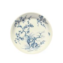 A good Worcester saucer dish, c.1758, painted in a pale blue with the Prunus Root pattern, with