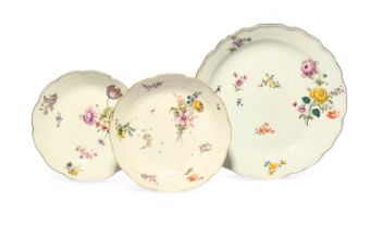 A pair of Meissen dishes, mid 18th century, each moulded with an osier border and painted with