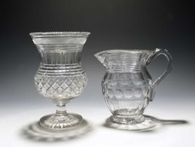 A cut glass water jug and a vase, 1st half 19th century, the jug with a band of polished ovals