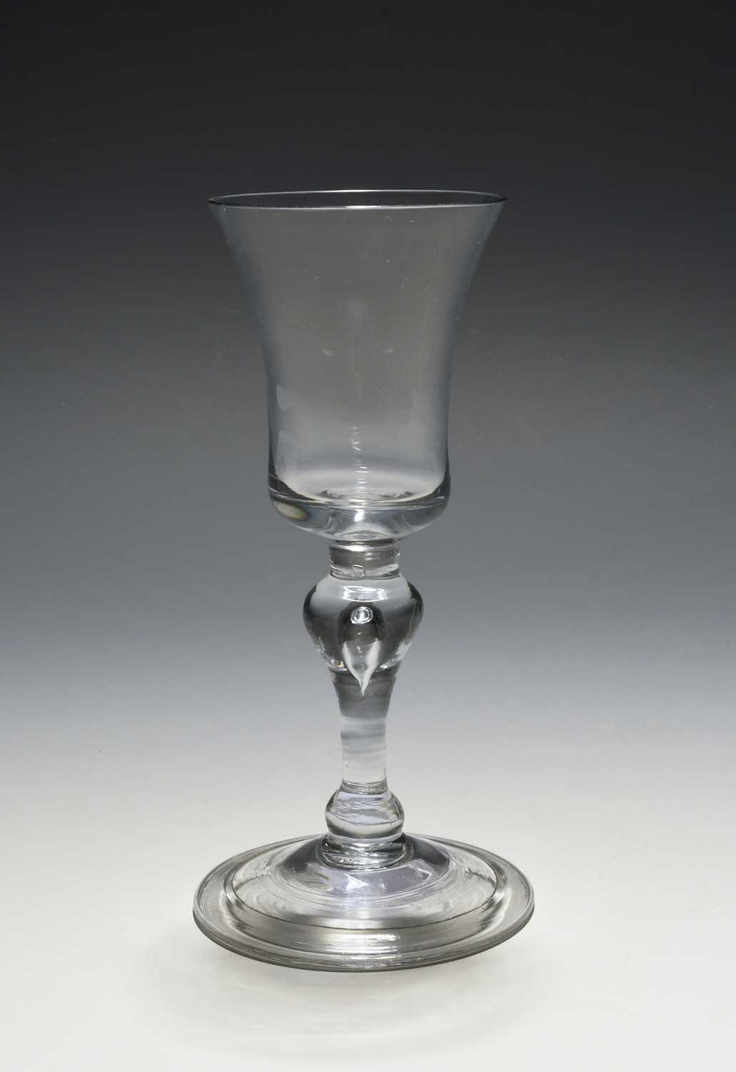 A small balustroid wine glass, c.1730-40, the bell bowl raised on a balustroid stem with a