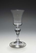 A small balustroid wine glass, c.1730-40, the bell bowl raised on a balustroid stem with a