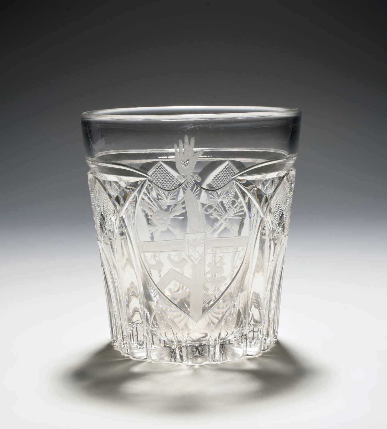 An armorial glass tumbler of Masonic significance, 19th century, engraved with a shield bearing a