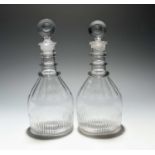 A pair of glass decanters and stoppers, c.1770-90, of mallet shape, the shoulders cut with