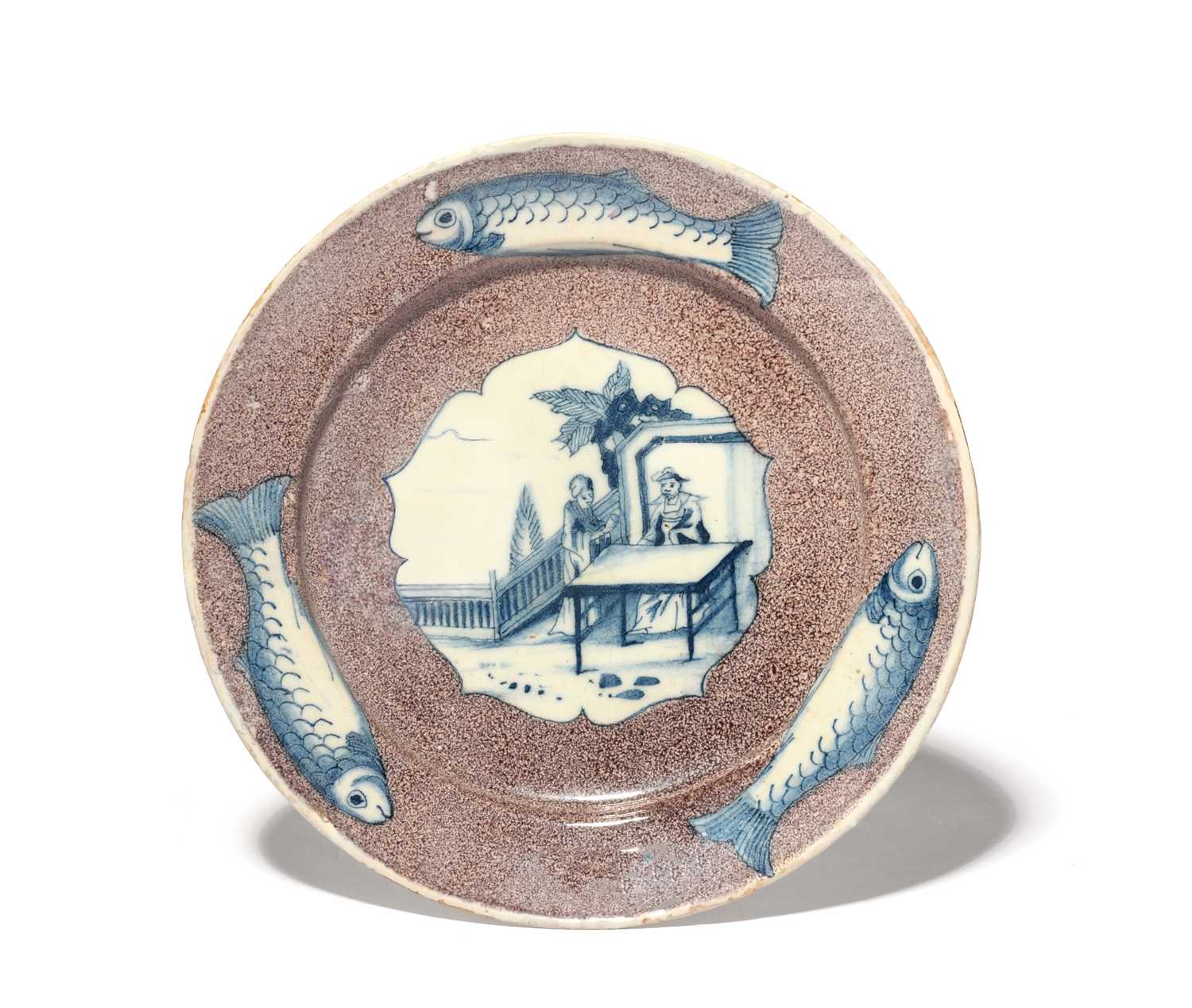 A delftware plate, c.1750, the well finely painted in blue with a Chinese dignitary seated at a