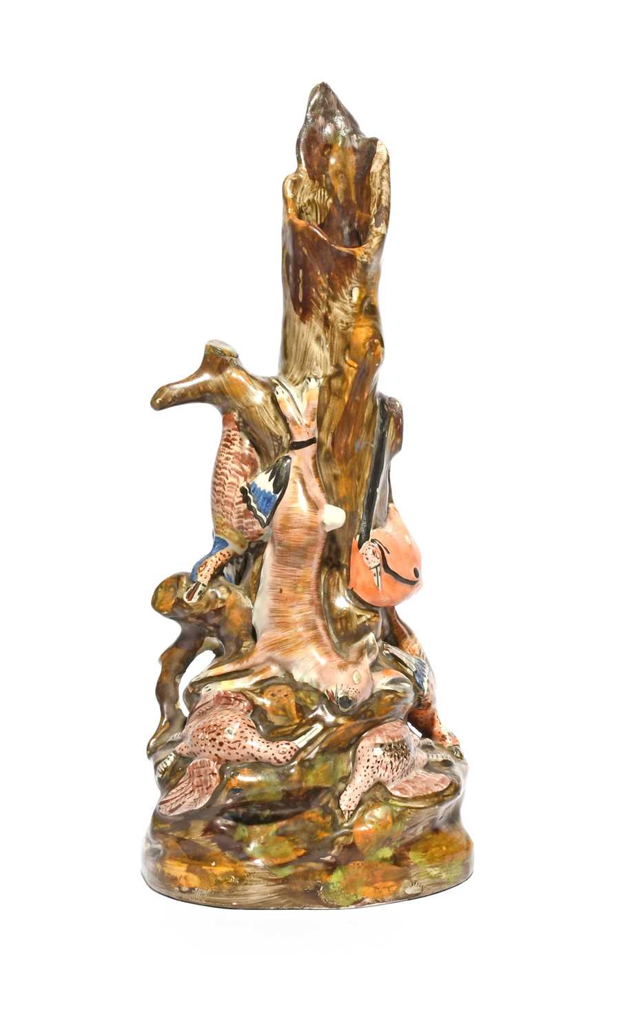 An unusual pearlware spill vase, early 19th century, formed as a hollow tree trunk draped with