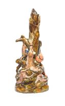 An unusual pearlware spill vase, early 19th century, formed as a hollow tree trunk draped with