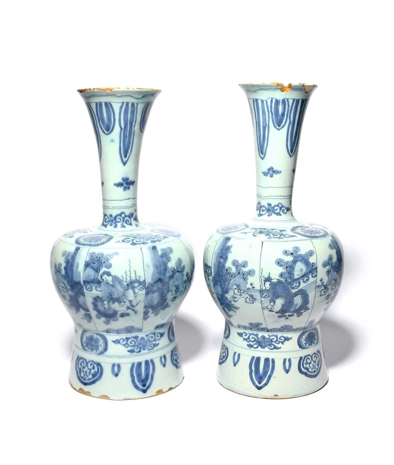 A pair of large Delft vases, c.1700, of Chinese shape, the baluster bodies painted with panels of