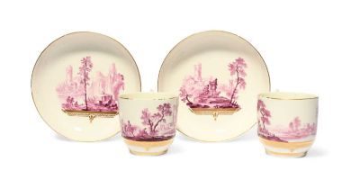 A good pair of Tournai coffee cups and saucers, c.1770, the generous forms painted in the manner