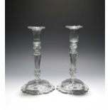 A pair of glass candlesticks, c.1770, with moulded sconces and moulded pedestal stems between beaded