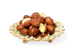 A Minton trompe l'oeil plate, c.1830, the well piled with sweet chestnuts, the spectacle rim applied