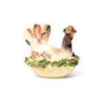 A Meissen model of a nesting chicken, mid 18th century, the hen seated in a nest of moss and