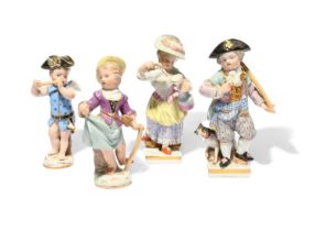 Four small Meissen figures, 19th century, two of Cupid in Disguise, one as a musician, the other