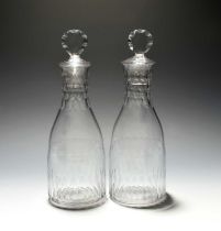 A pair of glass carafes and stoppers, late 18th century, cut with bands of lappets and polished