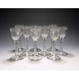Nine 'hidden Jacobite' wine glasses, c.1760-70, the ogee bowls engraved with a continuous band of