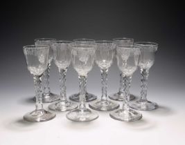 Nine 'hidden Jacobite' wine glasses, c.1760-70, the ogee bowls engraved with a continuous band of