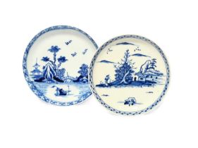 Two Vauxhall blue and white saucers, c.1755-57, one painted with a boat before an arched bridge