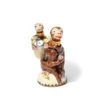 A rare Chelsea double scent bottle, c.1755, modelled as a brown monkey crouched on a domed base