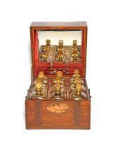 A cased set of nine French glass decanters and stoppers, early 19th century, the square decanters