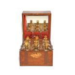 A cased set of nine French glass decanters and stoppers, early 19th century, the square decanters
