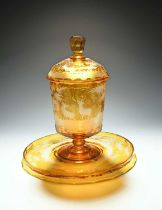 A large Bohemian glass punch pot with cover and stand, mid 19th century, flashed in amber and cut